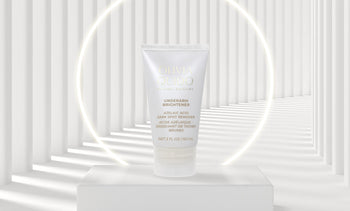 Olivia Quido Skincare Underarm Brightener tube in white environment