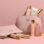 Olivia Quido Pink Faux Leather cosmetic bag on pink background as part of the Skin Refining Set