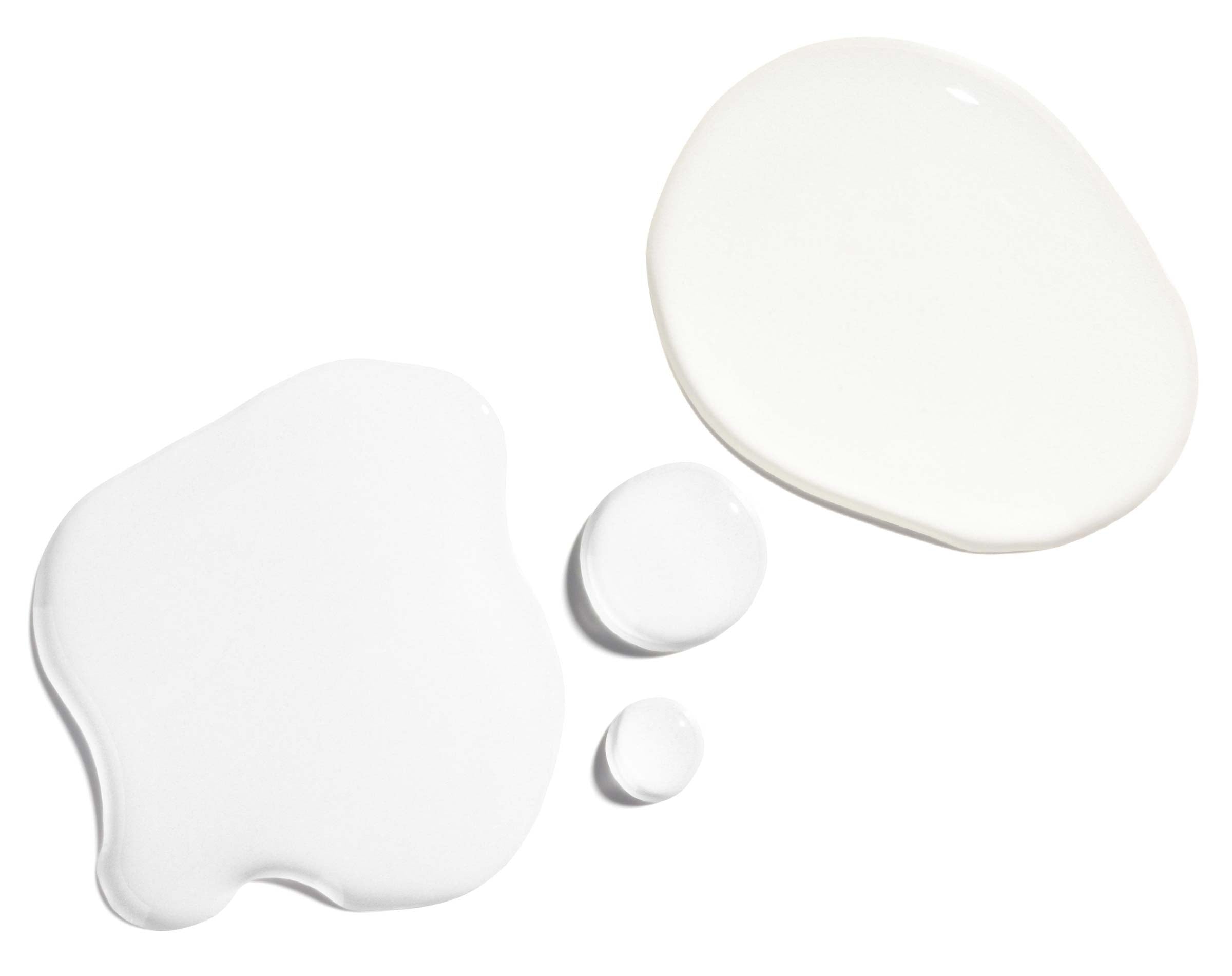Skin Refining Set white lotion drops showcasing smooth textures for radiant skin.