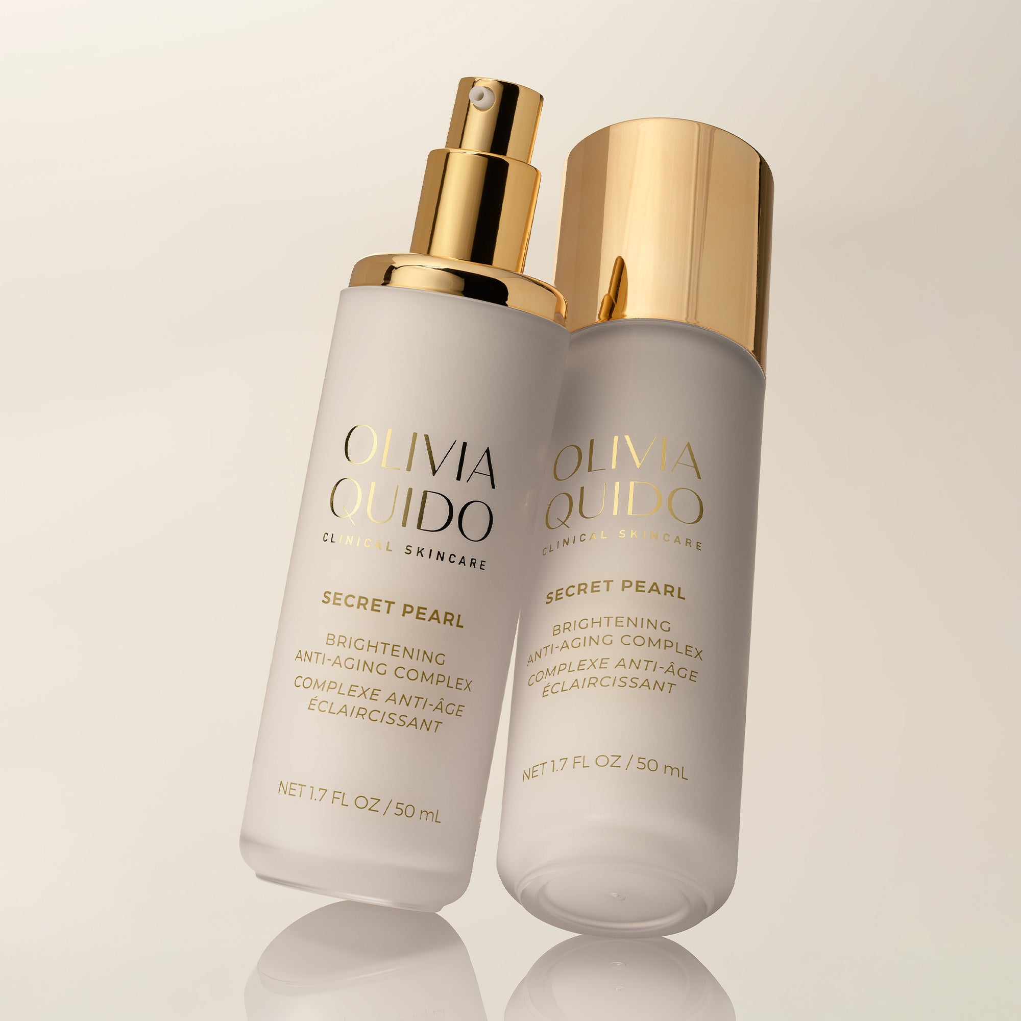 Olivia Quido Secret Pearl bottles leaning in hero photo